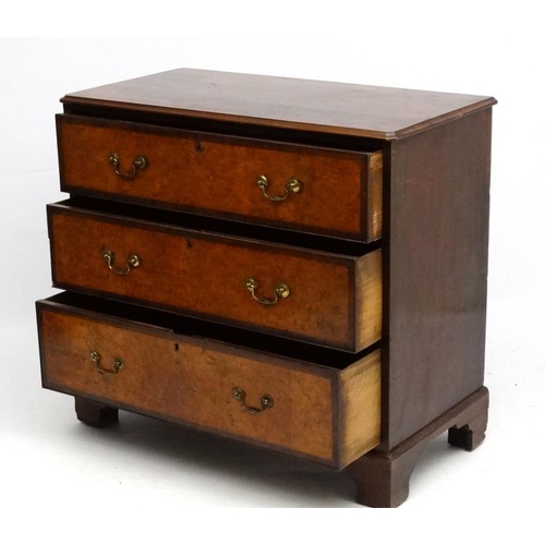 161 - Holland & Sons : An 19thC mahogany and cross banded and burr elm three drawer chest of drawers. Stam... 