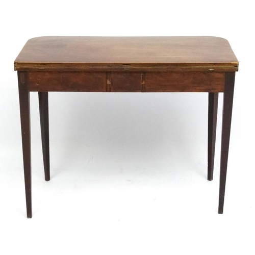 162 - A late 18thC mahogany fold over card table with squared tapering legs and two hinged back legs. 26''... 