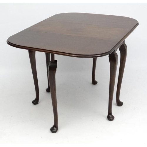 164A - A c1900 mahogany 6-leg drop flap dining table with pad feet in the Queen Anne style 35 1/4'' wide x ... 