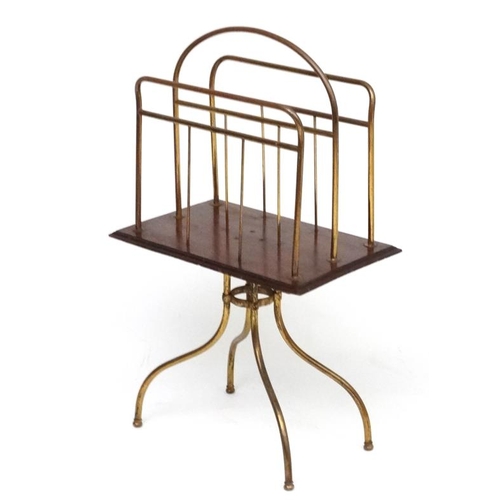 165 - An Edwardian brass and mahogany four legged Canterbury / magazine rack. 37'' high x 13 1/2'' wide x ... 