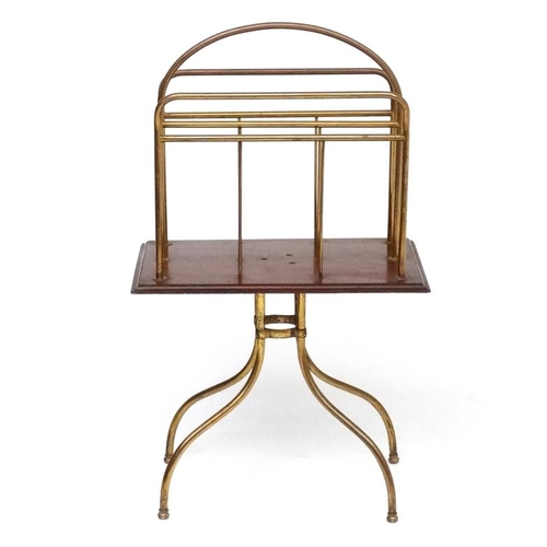 165 - An Edwardian brass and mahogany four legged Canterbury / magazine rack. 37'' high x 13 1/2'' wide x ... 