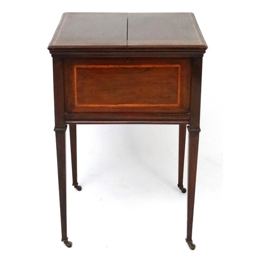 166 - An Edwardian inlay mahogany drinks cabinet with raising shelf and glass bottomed tray within. 21 7/8... 