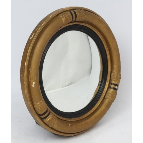 171 - A Victorian gilt wood circular convex wall mirror . 22'' diameter