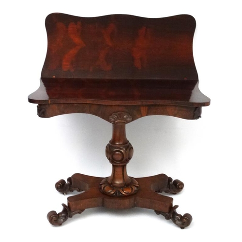 172 - A mid 19thC Rosewood serpentine fronted fold over tea table of pedestal form on a four footed base 3... 