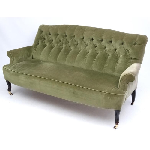 174 - A late Victorian button back green draylon upholstered three-seat sofa 70'' wide x 35'' high