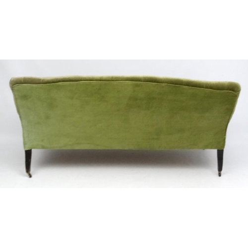 174 - A late Victorian button back green draylon upholstered three-seat sofa 70'' wide x 35'' high