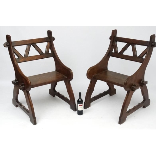 175 - Arts & Crafts : A pair of c.1900  Pugin inspired oak open chairs 38'' high x 27 1/2'' wide