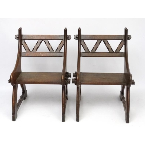 175 - Arts & Crafts : A pair of c.1900  Pugin inspired oak open chairs 38'' high x 27 1/2'' wide