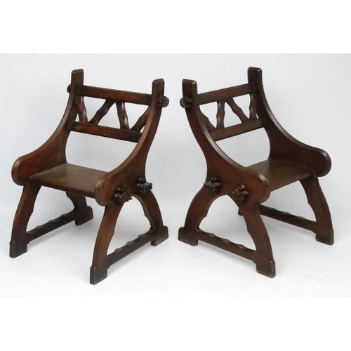 175 - Arts & Crafts : A pair of c.1900  Pugin inspired oak open chairs 38'' high x 27 1/2'' wide