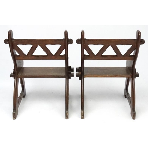 175 - Arts & Crafts : A pair of c.1900  Pugin inspired oak open chairs 38'' high x 27 1/2'' wide