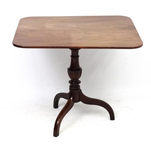 181 - A Georgian mahogany square topped tilt top tripod table 30 1/4'' x 34 1/2''