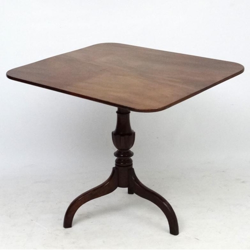 181 - A Georgian mahogany square topped tilt top tripod table 30 1/4'' x 34 1/2''