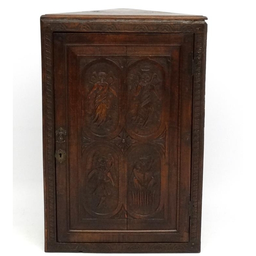 182 - A Victorian and later carved oak hanging corner cupboard 39 1/4'' high