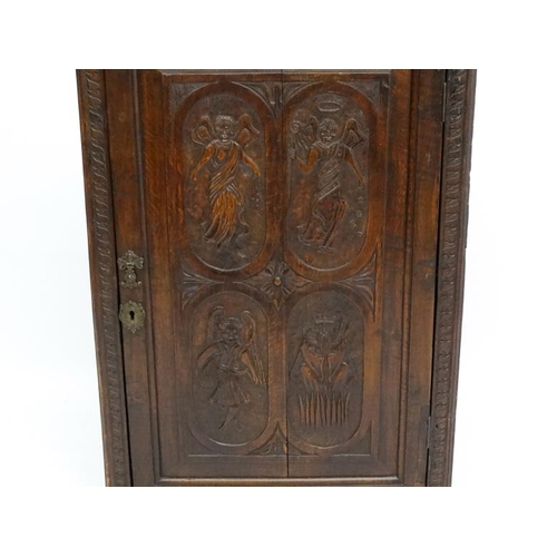 182 - A Victorian and later carved oak hanging corner cupboard 39 1/4'' high