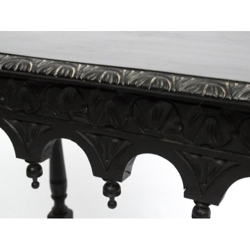 184 - A late Victorian Neo Gothic ebonised table  13 1/2'' wide x 20 1/2'' deep x 28 1/2'' high