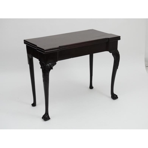 185 - An early - mid 18thC mahogany fold over card table with pad feet and ball and claw cabriole legs, on... 