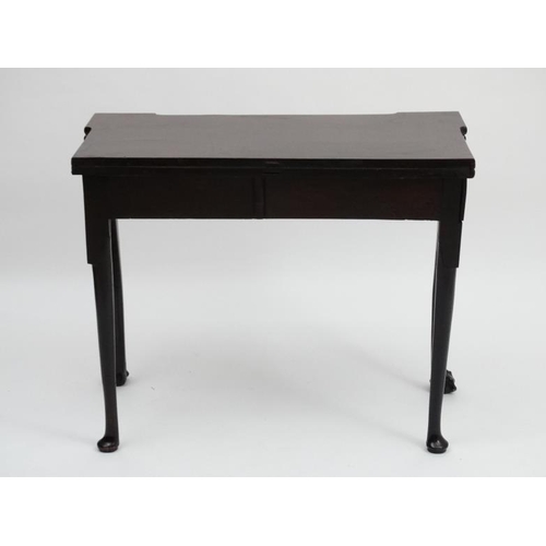 185 - An early - mid 18thC mahogany fold over card table with pad feet and ball and claw cabriole legs, on... 