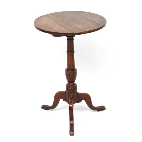 187A - A circa 1800  oak tilt top , tripod table with circular top measuring 18 1/4'' diameter and standing... 