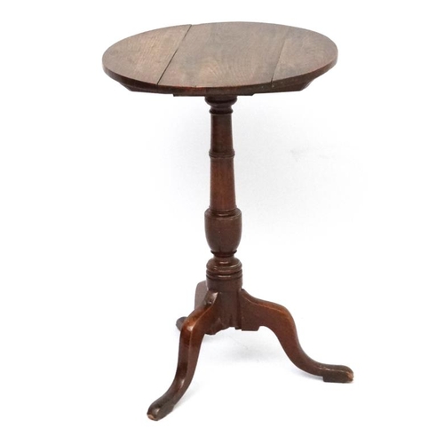 187A - A circa 1800  oak tilt top , tripod table with circular top measuring 18 1/4'' diameter and standing... 