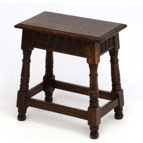 188A - An early- mid 20 thC Oak Joint stool in the Commonwealth style , made by Laverty , bears label under... 