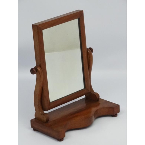 197 - A 19thC mahogany toilet mirror on shaped base 15'' wide x 18 1/2'' high