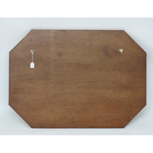 211 - Art Deco : an octagonal bevel edged mirror with reverse engraving , measuring 25 3/4 x 36''