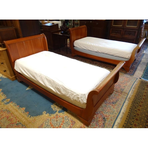 222 - A pair of mid-20thC Continental hardwood single sleigh beds. 39'' wide