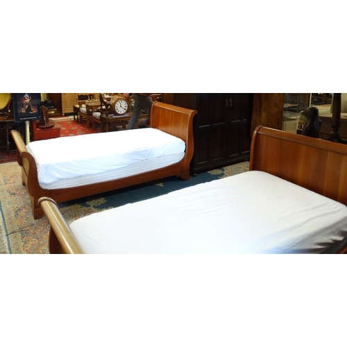 222 - A pair of mid-20thC Continental hardwood single sleigh beds. 39'' wide