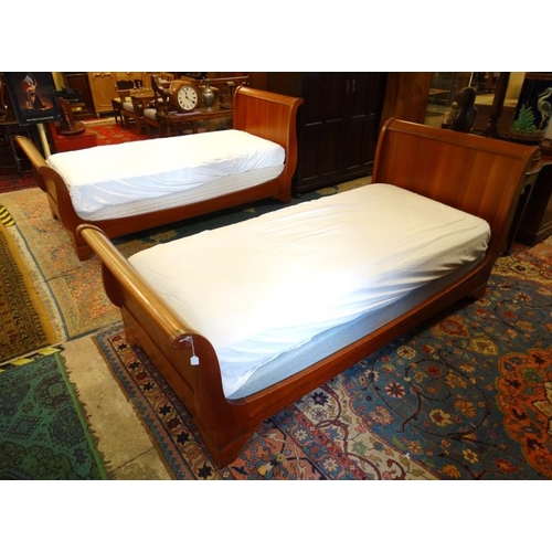 222 - A pair of mid-20thC Continental hardwood single sleigh beds. 39'' wide