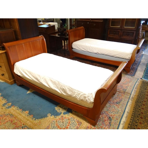 222 - A pair of mid-20thC Continental hardwood single sleigh beds. 39'' wide