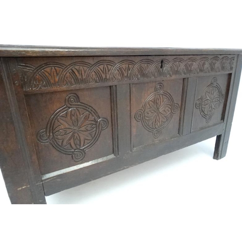 223 - A Late 17thC carved oak 3-panel coffer with peg joints and original hinges. 51 1/2'' wide x 22'' dee... 