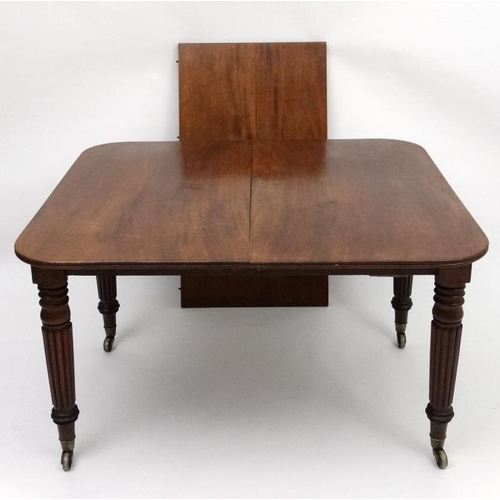 229 - An early 19thC mahogany pull out / drawer out extending dining table by J Cranston in the manner of ... 