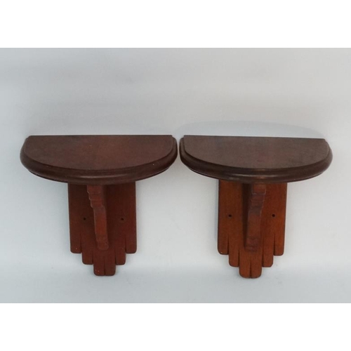 233 - A Pair of mahogany ? wooden clock brackets of supported demi-lune shape , measuring  13 1/2'' wide a... 