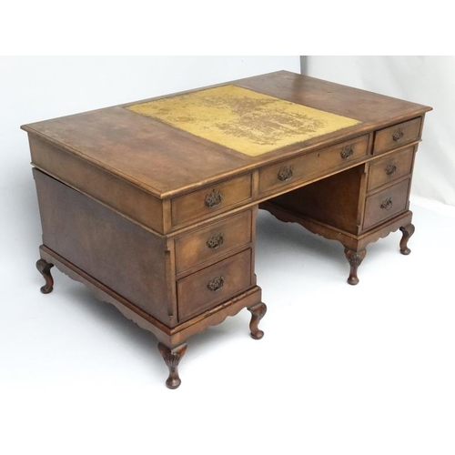 236 - A 1920's walnut twin pedestal writing desk with leather insert to top 36'' deep x 60'' wide x 29 1/2... 