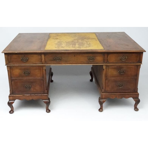 236 - A 1920's walnut twin pedestal writing desk with leather insert to top 36'' deep x 60'' wide x 29 1/2... 