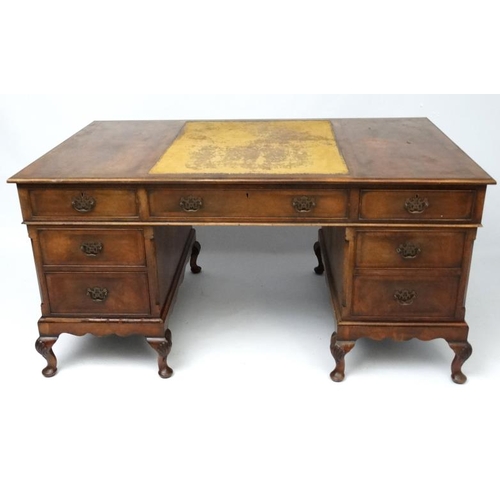 236 - A 1920's walnut twin pedestal writing desk with leather insert to top 36'' deep x 60'' wide x 29 1/2... 