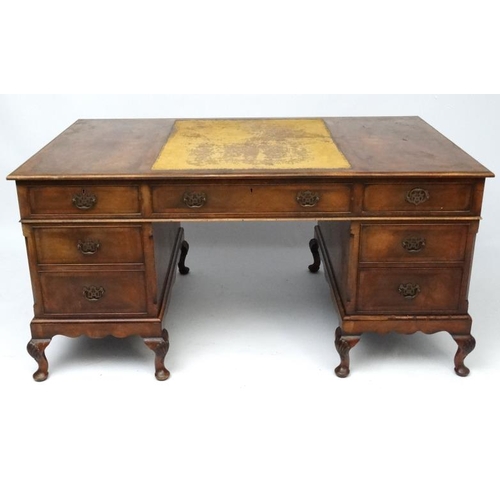 236 - A 1920's walnut twin pedestal writing desk with leather insert to top 36'' deep x 60'' wide x 29 1/2... 