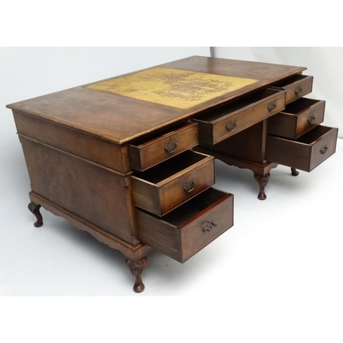 236 - A 1920's walnut twin pedestal writing desk with leather insert to top 36'' deep x 60'' wide x 29 1/2... 