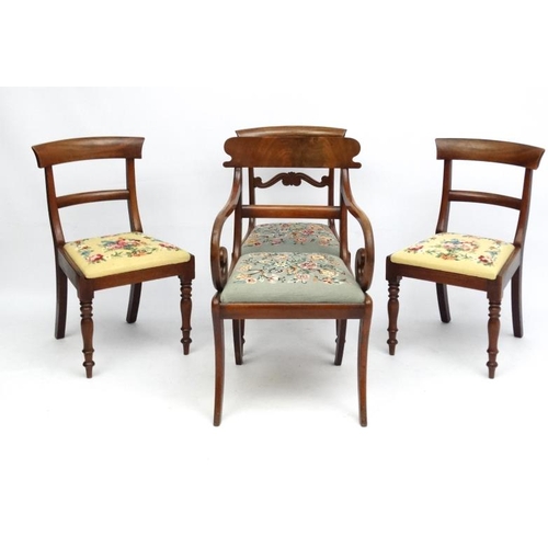 237 - A set of 4 Regency period mahogany and Rosewood dining chairs, including a carver chair with sabre l... 