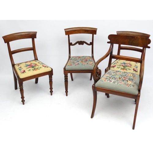 237 - A set of 4 Regency period mahogany and Rosewood dining chairs, including a carver chair with sabre l... 