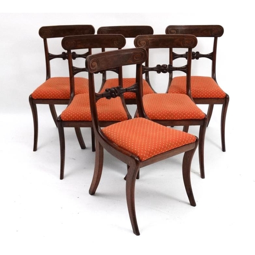 243 - A set of 6 Regency mahogany sabre legged dining chairs with drop in seats, 34'' high