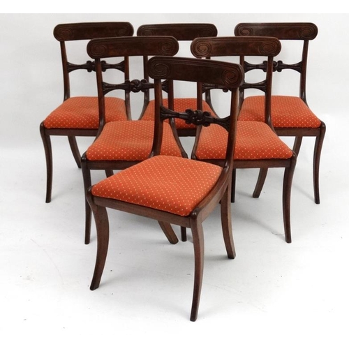 243 - A set of 6 Regency mahogany sabre legged dining chairs with drop in seats, 34'' high