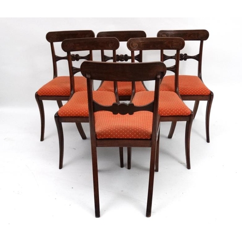 243 - A set of 6 Regency mahogany sabre legged dining chairs with drop in seats, 34'' high