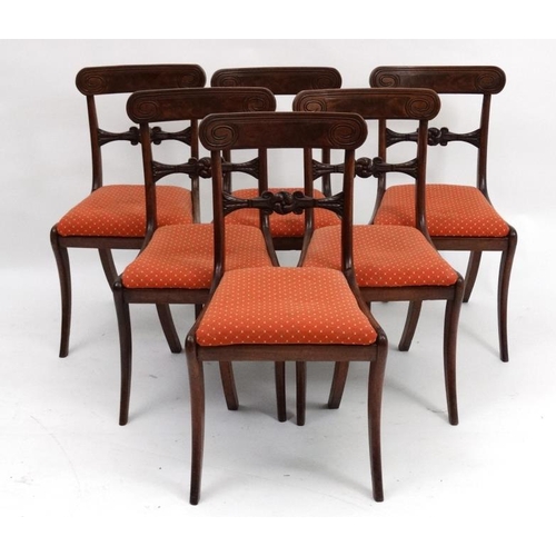 243 - A set of 6 Regency mahogany sabre legged dining chairs with drop in seats, 34'' high