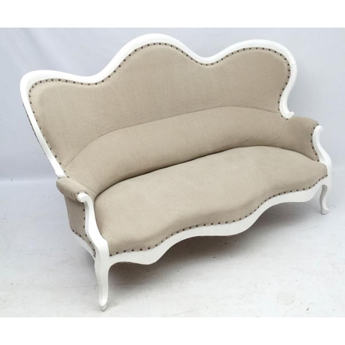 245 - A 19thC Continental shaped settee with white painted wooden frame and calico like upholstery. 68'' w... 