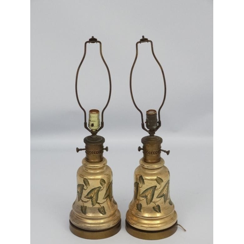 251 - A pair of early 20thC oil lamp conversions now formed as electric table lamps with gilded brass and ... 