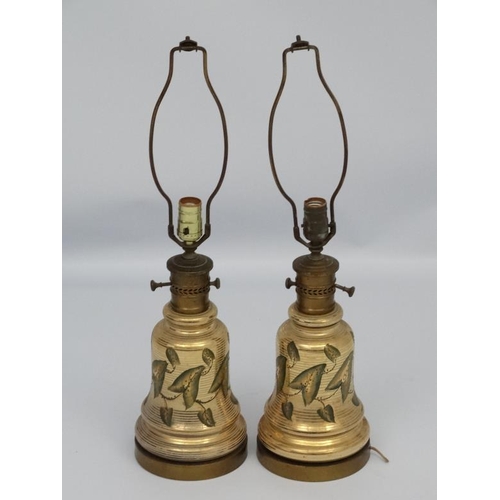 251 - A pair of early 20thC oil lamp conversions now formed as electric table lamps with gilded brass and ... 