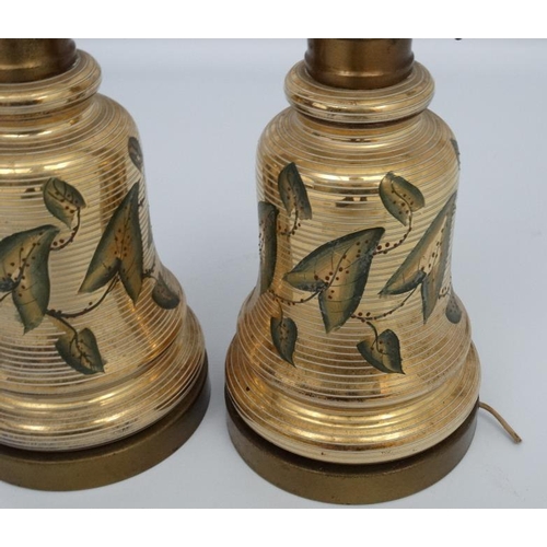 251 - A pair of early 20thC oil lamp conversions now formed as electric table lamps with gilded brass and ... 