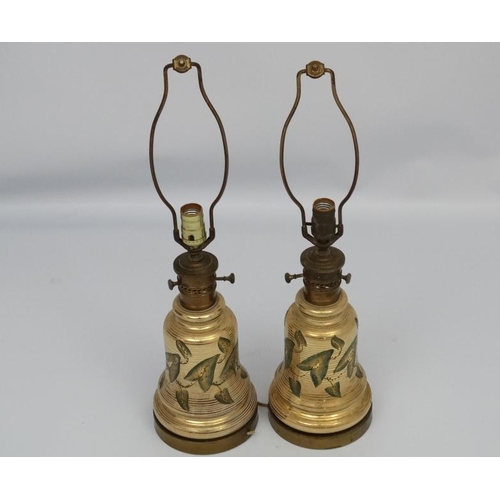 251 - A pair of early 20thC oil lamp conversions now formed as electric table lamps with gilded brass and ... 