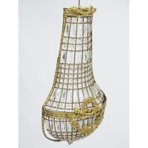 252 - A 20thC Continental Regency style glass luster wall shade of  basket shape. Approx 27'' high